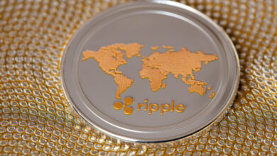 Ripple coin, XRP token, cryptocurrency on golden background